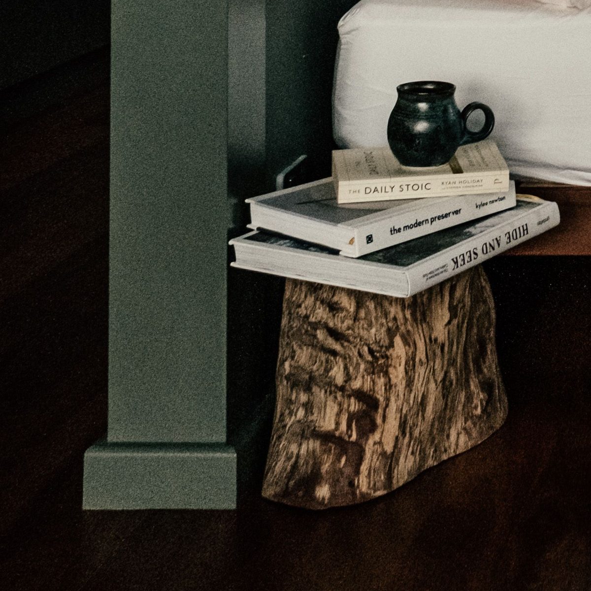 Bedside stump table, mug and books — Concept Project / Stock Imagery