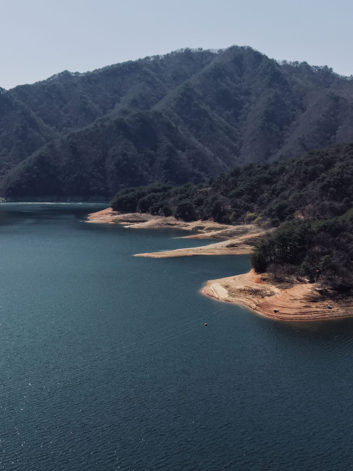 Low green Korean mountain ridge and lake — Concept Project / Stock Imagery, not the actual property location